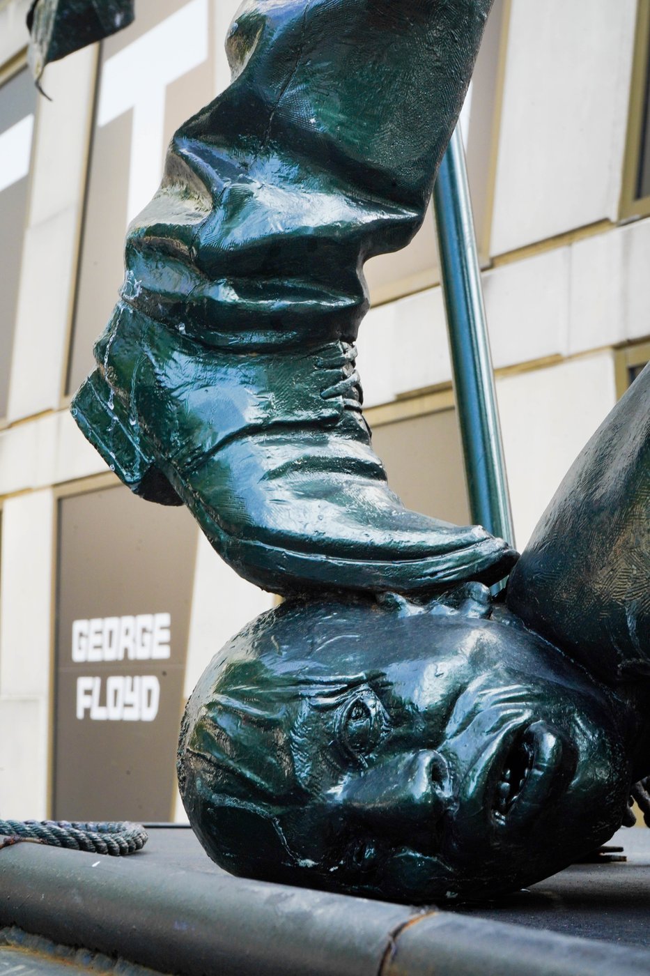 The slave ancestor at the base — George Floyd backdrop, Times Square