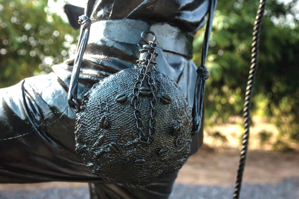 The Memory Jug — cowrie shells and chains